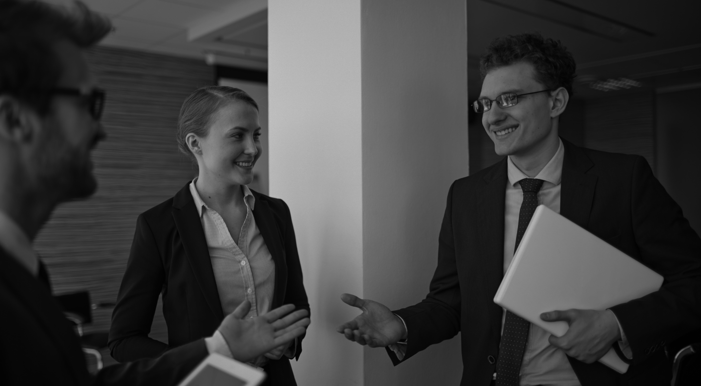 A picture showing 3 happy people with one of them being a customer